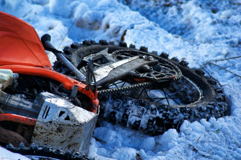 motorcycle lying in snow