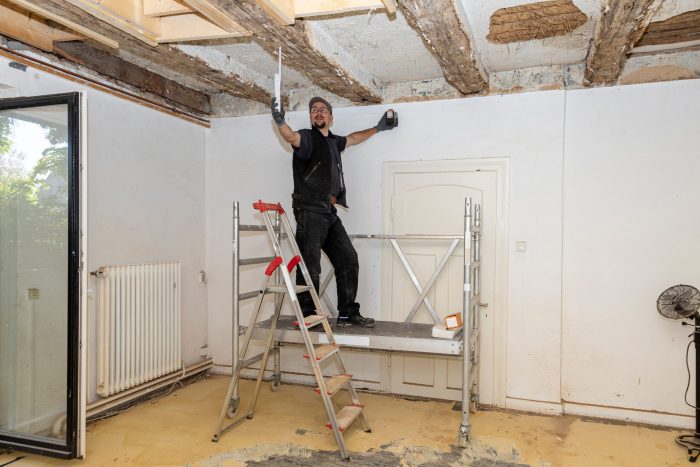 carpenter working on ceiling